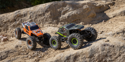 Two RC All-Terrain Vehicles on rocks